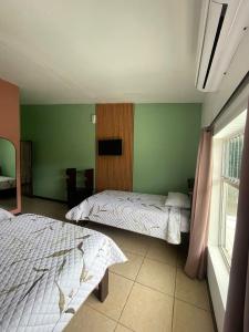 Hotel Mi Linda Tierra客房内的一张或多张床位