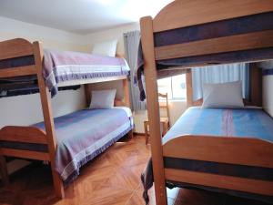 Postel nebo postele na pokoji v ubytování Conquistador Hotel