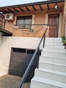 a set of stairs in front of a building with a door at Departamento Batti in Asuncion