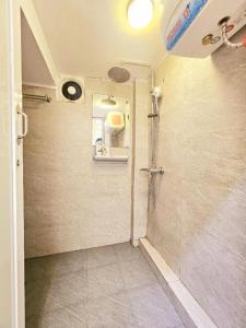 a bathroom with a shower and a sink at Azalea Apartment in Hanoi +65 photos