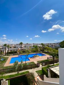 a view of a swimming pool from a building at Condado de Alhama, Jardin 11 in Alhama de Murcia