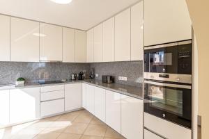 A kitchen or kitchenette at Villa Victoria With Heated Pool