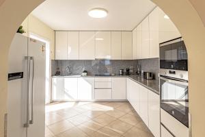 A kitchen or kitchenette at Villa Victoria With Heated Pool
