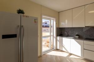 A kitchen or kitchenette at Villa Victoria With Heated Pool
