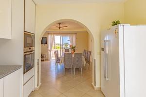 A kitchen or kitchenette at Villa Victoria With Heated Pool