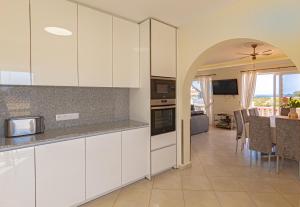 A kitchen or kitchenette at Villa Victoria With Heated Pool
