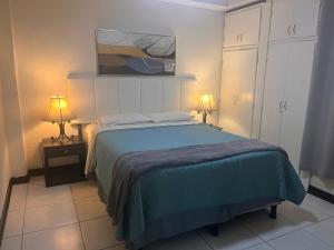 Postel nebo postele na pokoji v ubytování Aparta-hotel Carmela #4 Aire acondicionado