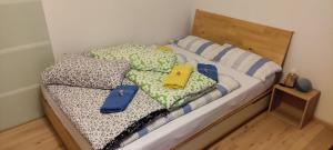 a bedroom with a bed with two pillows on it at Wohnung im Zentrum mit Ausblick in Offenbach