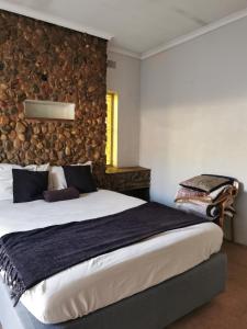Katil atau katil-katil dalam bilik di GLESTER GUEST HOUSE