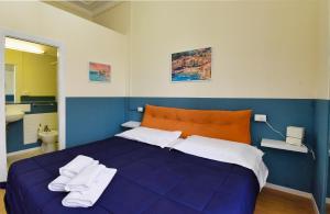 Posteľ alebo postele v izbe v ubytovaní Hotel Suisse + 25 fotografií