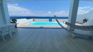 The swimming pool at or close to NV seafront villa Aegina 1