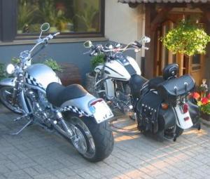 two motorcycles parked in front of a building at Pension Ochsen, Ferienwohnungen in Löffingen