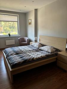 Postel nebo postele na pokoji v ubytování BLUE MARE Apartamenty MES