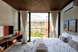 Cama ou camas em um quarto em Natu Boutique Stays