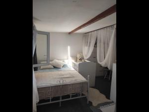 a bedroom with a bed and a large mirror at Maison loft, jacuzzi in Livry-Gargan