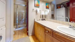 a bathroom with a sink and a shower at Atelier Condo 1080 in Sun Valley +15 photos