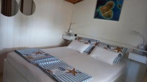 Postel nebo postele na pokoji v ubytování Felix Apartment Biograd