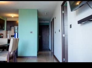 a kitchen with a blue door and a dining room at The king inn Habitacion # 3 Estadia por habitacion in Guatemala +3 photos