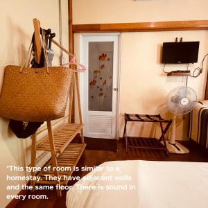 a room with a basket and a door at Mangrove bungalow & restaurant in Ko Kood