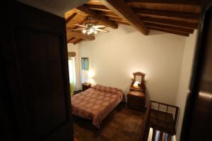 A bed or beds in a room at Casamatta a Blera