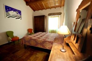 A bed or beds in a room at Casamatta a Blera