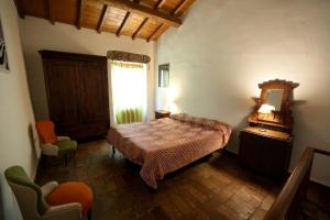 A bed or beds in a room at Casamatta a Blera