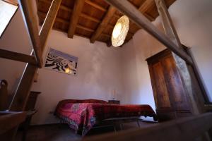 A bed or beds in a room at Casamatta a Blera
