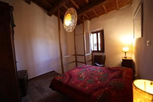 A bed or beds in a room at Casamatta a Blera