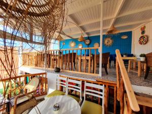 a dining room with a table and chairs at Riad art house in El Jadida