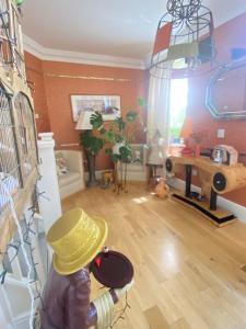 a living room with a cowboy hat on the wall at Upton Country Park Guest House in Northampton