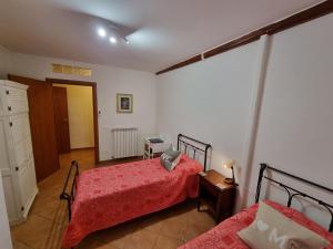 Ένα ή περισσότερα κρεβάτια σε δωμάτιο στο Alloggio turistico Leonardo