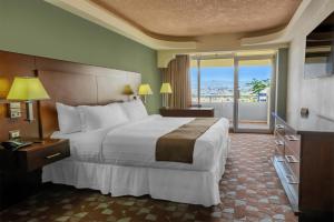Giường trong phòng chung tại Hotel Plaza San Martin