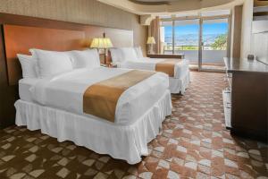 Giường trong phòng chung tại Hotel Plaza San Martin