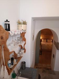 a room with a room with a bed and some shelves at Latmos 1860 in Skala