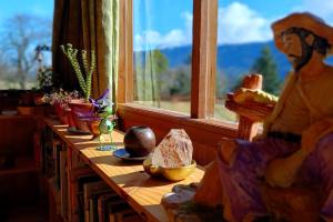 a table in a room with a window at Family home, panoramic views of lake & countryside in Puerto Rico