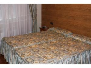 Postel nebo postele na pokoji v ubytování Hostal Castilla