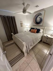 a bedroom with a large bed in a room at Lagniappe Retreat in Long Beach