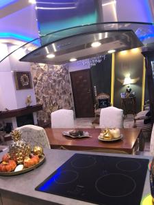 a dining room with a table with food on it at Balcony With A View in Nafplio