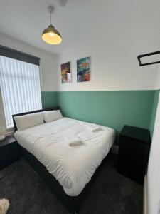 a bedroom with a bed in a room with a window at Luna Apartments Newcastle Gateshead 1 in Gateshead