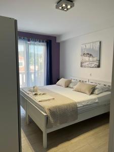 Postel nebo postele na pokoji v ubytování Villa Drinka Apartments