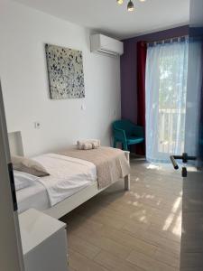 Postel nebo postele na pokoji v ubytování Villa Drinka Apartments