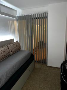 Postel nebo postele na pokoji v ubytování TREJO APART, A 40MTS DEL PATIO OLMOS, PLANTA BAJA + 4 fotografie