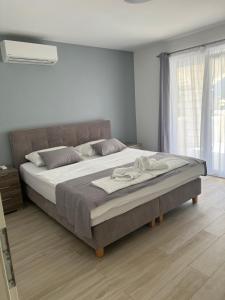 Postel nebo postele na pokoji v ubytování Villa Drinka Apartments