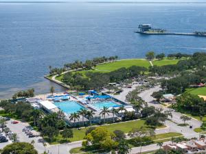 an aerial view of a resort with a swimming pool at St Pete Boho Getaway Walk to Pier and Beach in St. Petersburg