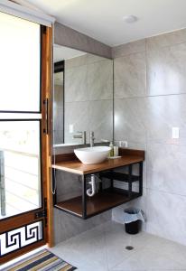 a bathroom with a sink and a mirror at Villa Monarca, Hermosa Casa cerca a Villa de Leyva in Villa de Leyva +60 photos
