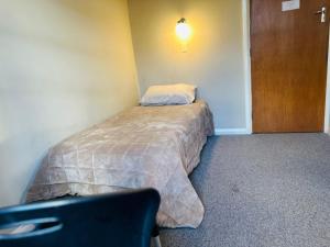 Postel nebo postele na pokoji v ubytování Merrylees Hotel