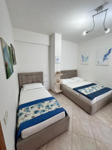 a bedroom with two beds in a room at AURI'S HOUSE in Vlorë