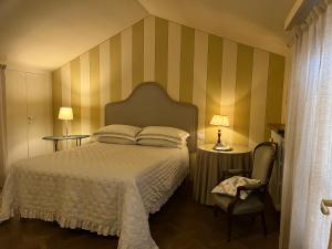 Rúm í herbergi á B&B Artincentro