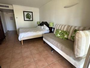 Postel nebo postele na pokoji v ubytování Le Flora, 2 chambres, vue mer