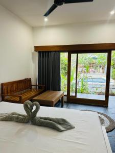 Katil atau katil-katil dalam bilik di Santai Retreat